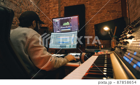 Dj producer is mixing a new music track 87858654