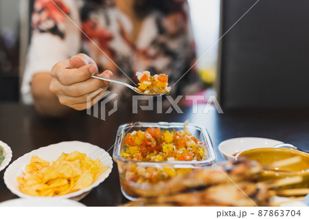 Homemade tomato sauce salsa dip with nachos on table. 87863704