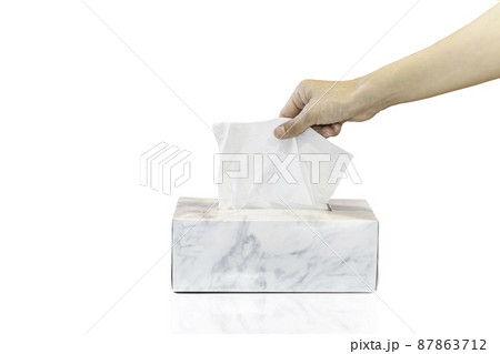 Woman hand picking white tissue paper from tissue box isolated in white background. Woman hand picking white tissue paper from tissue box isolated in white background. 87863712