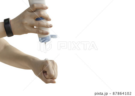 Woman pouring sun protection cream on her hand isolated in clipping path. 87864102