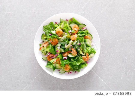 Shrimps avocado salad with cucumbers and lettuce. Top view, flat lay 87868998