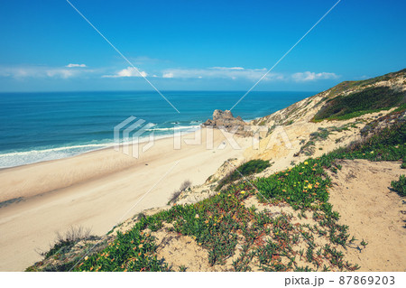 Rocky seashore on a sunny day. Areeira the beach, Portugal, Europe Rocky seashore on a sunny day. Areeira the beach, Portugal, Europe 87869203