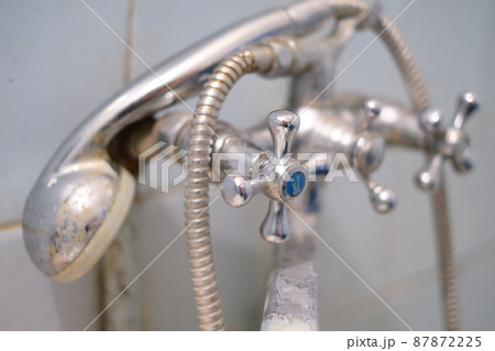 Selective focus, old rusty dirty plumbing in the bathroom close-up Selective focus, old rusty dirty plumbing in the bathroom close-up 87872225