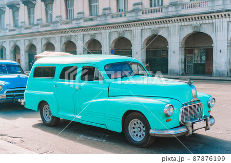 View of yellow classic vintage car in Old Havana, Cuba View of yellow classic vintage car in Old Havana, Cuba 87876199