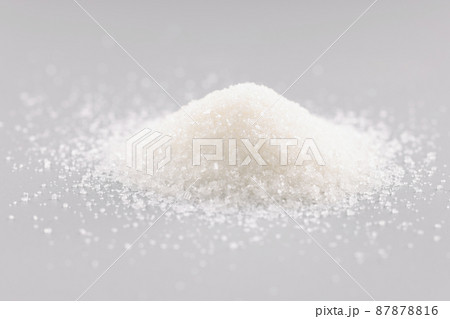 Sugar crystals pile on grey background, heap of sweet powder, sugar substitute Sugar crystals pile on grey background, heap of sweet powder, sugar substitute 87878816
