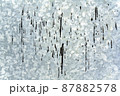 Silver background in the form of a sheet of galvanized textured steel with black drops of resin. 87882578