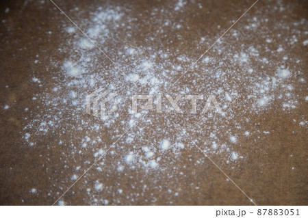 The baking parchment is strewn with flour in dark tones. High quality photo The baking parchment is strewn with flour in dark tones. High quality photo 87883051