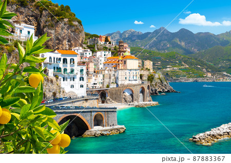 Beautiful view of Amalfi on the Mediterranean coast with lemons in the foreground, Italy Beautiful view of Amalfi on the Mediterranean coast with lemons in the foreground, Italy 87883367