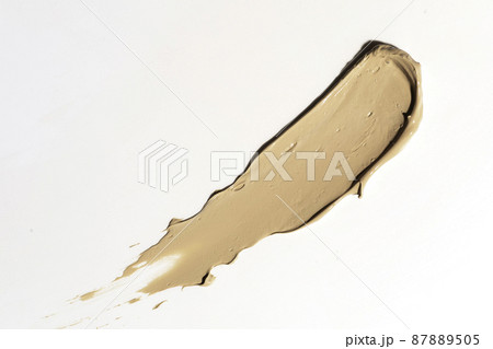 Creamy foundation smeared on white background. Isolated. Beauty and fashion conception. 87889505