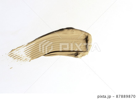 Creamy foundation smeared on white background. Isolated. Beauty and fashion conception. 87889870