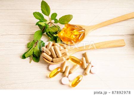 Alternative medicine herbal organic capsule with vitamin E omega 3 fish oil, mineral, drug with herbs leaf natural supplements for healthy good life. 87892978