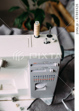 Sewing machine, accessories and fabric. Cozy creative sewing process at home 87893426