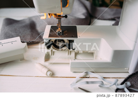 Sewing machine, accessories and fabric. Cozy creative sewing process at home 87893427
