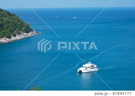 Aerial View of Yacht boat or sailboat luxury boat in tropical summer sea. Transportation and travel background Beautiful sea in summer season at Phuket island Thailand 87894777