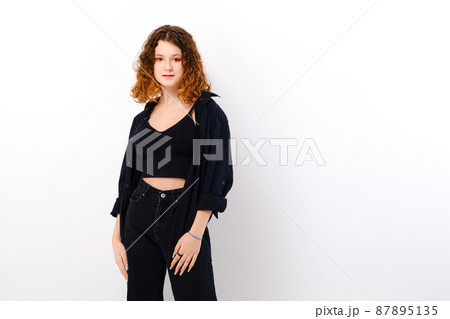 Beautiful teenage girl in casual clothing with colored in red ends of hair 87895135