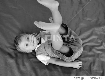 Beautiful baby boy with child face posing photographer 87896712