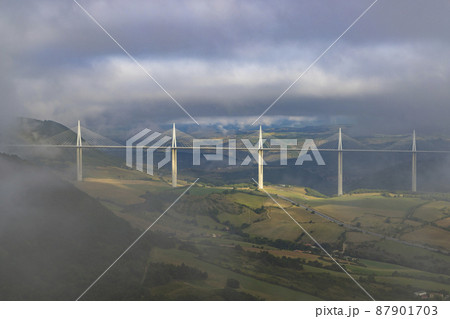 Multi-span cable stayed Millau Viaduct across gorge valley of Tarn River, Aveyron Departement, France Multi-span cable stayed Millau Viaduct across gorge valley of Tarn River, Aveyron Departement, France 87901703