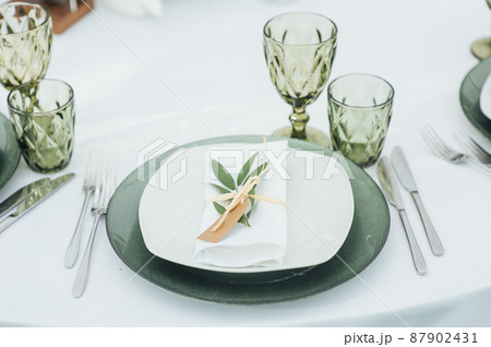 Wedding. Banquet. The chairs and round table for guests, served with cutlery. Wedding. Banquet. The chairs and round table for guests, served with cutlery. 87902431