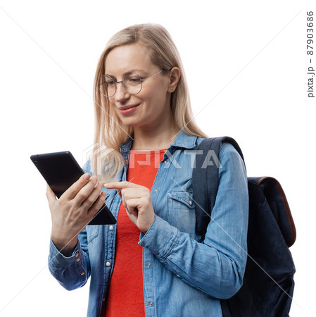Woman using tablet for studying Woman using tablet for studying 87903686