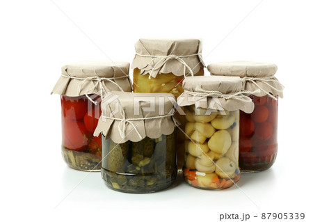 Jars of pickled vegetables isolated on white background Jars of pickled vegetables isolated on white background 87905339