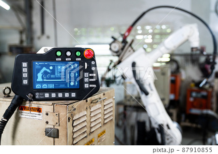Robotic arm and its controller adept panel in a factory workshop 87910855
