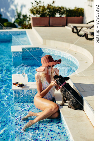 happy woman relax in swimming pool on summer vacations happy woman relax in swimming pool on summer vacations 87915392