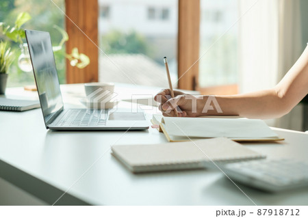 E-learning ,online ,education and internet social distancing protect from COVID-19 viruses concept. Asian woman student video conference e-learning with teacher on laptop at home. 87918712