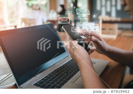 Contact Message and Electronic Mailbox Concept, Businesswoman Received Email While Using Smartphone and Laptop Computer With Icons Virtual Screen. Digital Contact Mail for Business Communication Contact Message and Electronic Mailbox Concept, Businesswoman Received Email While Using Smartphone and Laptop Computer With Icons Virtual Screen. Digital Contact Mail for Business Communication 87919402