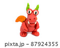 Play plasticine Dragon on white background. Handmade clay plasticine 87924355