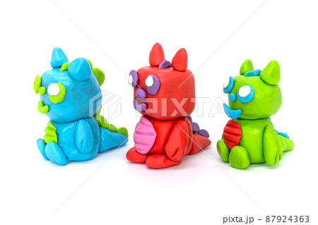 Play plasticine Dragon on white background. Handmade clay plasticine 87924363