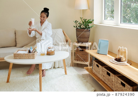 Woman Applying Moisturizing Lotion Woman Applying Moisturizing Lotion 87924390