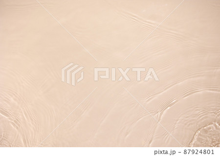 transparent beige colored clear calm water surface texture  87924801