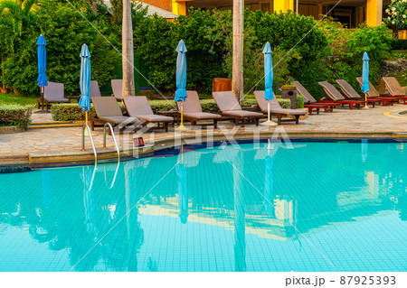 beach chair or pool bed with umbrella around swimming pool beach chair or pool bed with umbrella around swimming pool 87925393