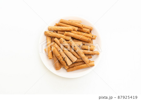 crispy coconut roll on plate 87925419