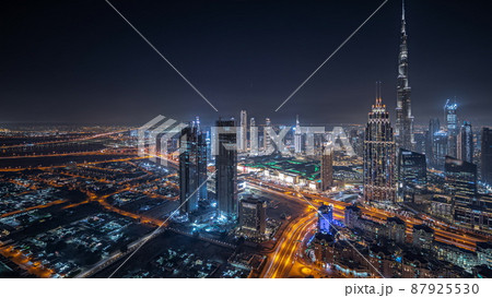 Panorama showing aerial view of tallest towers in Dubai Downtown skyline and highway night timelapse. Panorama showing aerial view of tallest towers in Dubai Downtown skyline and highway night timelapse. 87925530