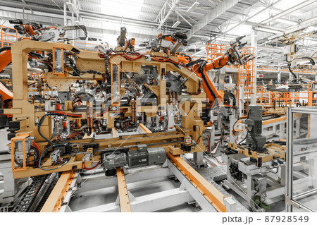 Photo of automobile production line. Welding car body. Modern car assembly plant. Auto industry 87928549