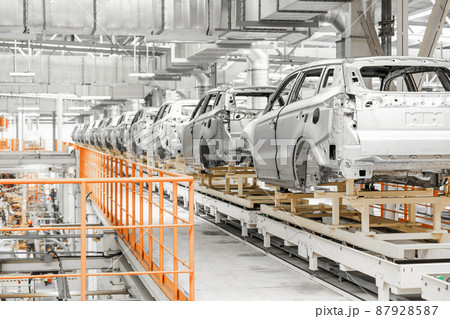 Photo of automobile production line. Welding car body. Modern car assembly plant. Auto industry Photo of automobile production line. Welding car body. Modern car assembly plant. Auto industry 87928587