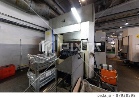 Photo of modern automobile manufacturing workshop. Factory with steel constructions. Plant concept Photo of modern automobile manufacturing workshop. Factory with steel constructions. Plant concept 87928598