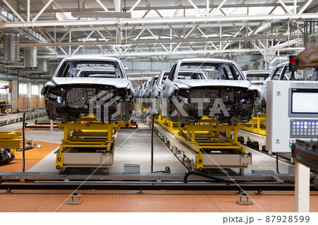Photo of automobile production line. Welding car body. Modern car assembly plant. Auto industry 87928599