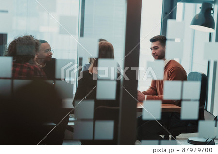 Successful team. Group of young multi-ethnic business people working and communicating together in creative office. Selective focus Successful team. Group of young multi-ethnic business people working and communicating together in creative office. Selective focus 87929700