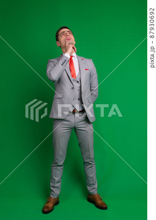 Young business man full body isolated on white and green background 87930692