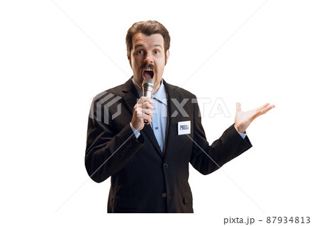 Emotive young man, professional sport commentator, journalist with microphone broadcasting football match isolated over white background. Sport, news concept Emotive young man, professional sport commentator, journalist with microphone broadcasting football match isolated over white background. Sport, news concept 87934813