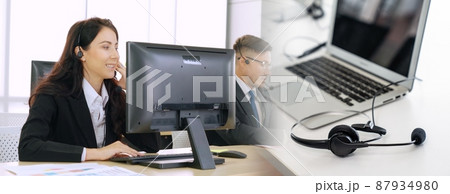 Business people wearing headset working in office broaden view 87934980