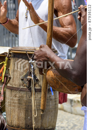 Musicians playing handmade instruments used in capoeira in Salvador, Bahia Musicians playing handmade instruments used in capoeira in Salvador, Bahia 87936112