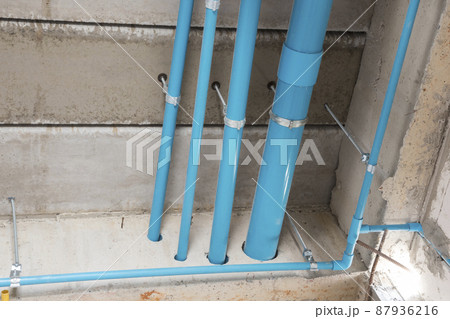 PVC tube in water piping system install under concrete floor in under construcion building PVC tube in water piping system install under concrete floor in under construcion building 87936216