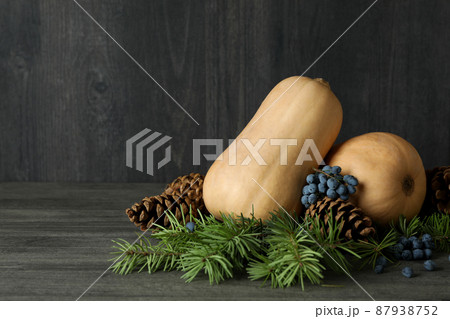 Thanksgiving Day composition with pumpkins on gray textured table Thanksgiving Day composition with pumpkins on gray textured table 87938752