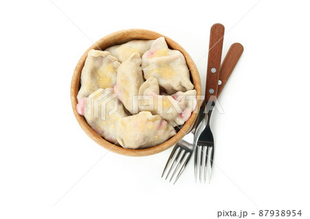 Bowl with pierogi with cherry isolated on white background Bowl with pierogi with cherry isolated on white background 87938954