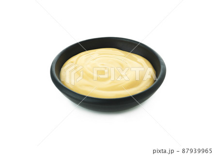 Bowl with cheese sauce isolated on white background Bowl with cheese sauce isolated on white background 87939965