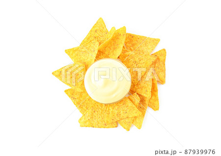 Bowl with cheese sauce and chips isolated on white background 87939976