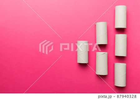 Flat lay composition with empty toilet paper rolls and space for text on color background. Recyclable paper tube with metal plug end made of kraft paper or cardboard 87940328